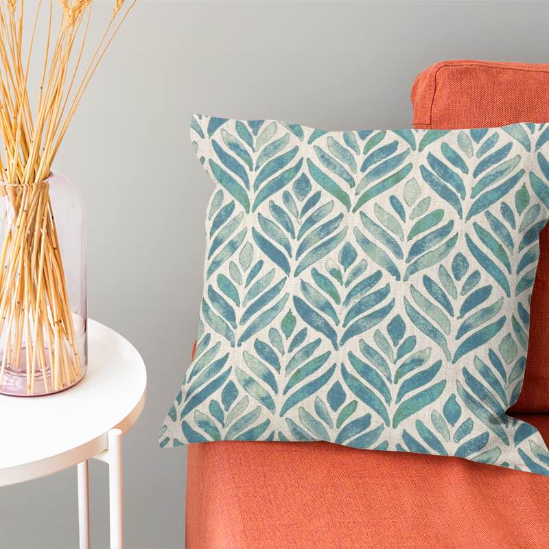 Beautiful watercolour leaves fabric in shades of green and blue, perfect for creating nature-inspired home decor and clothing items