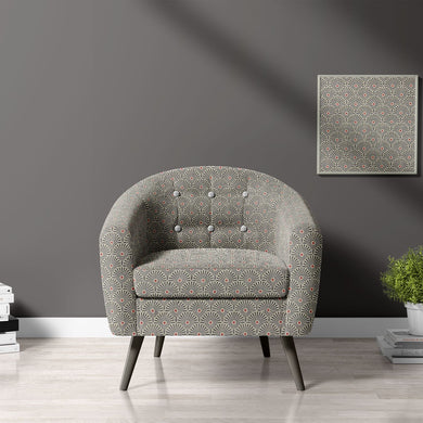 Armchair upholstered in Welford Charcoal fabric – highlighting bold geometric design in a modern setting.