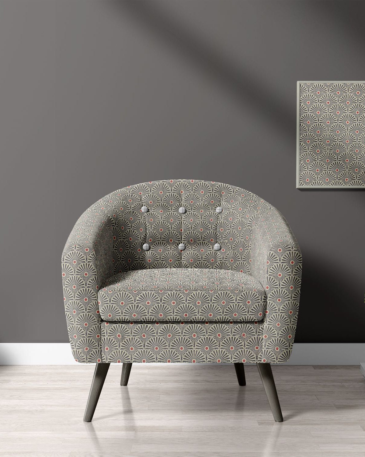 Armchair upholstered in Welford Charcoal fabric – highlighting bold geometric design in a modern setting.