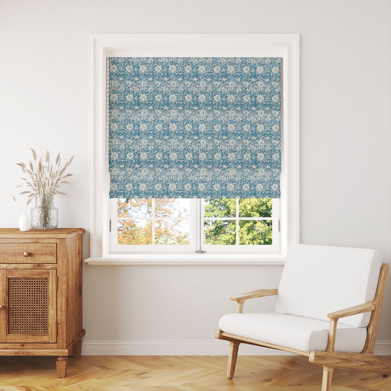 Blue floral curtain fabric seen in a soft window blind