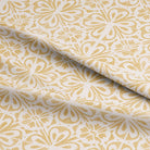 Close up of Ajmer Linen Curtain Fabric - Ochre showing its intricate weave and texture