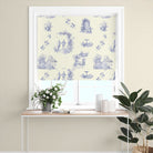 An interior design setting featuring Aquitaine Toile Cotton Curtain Fabric in Blue Ivory, creating a stylish and timeless look