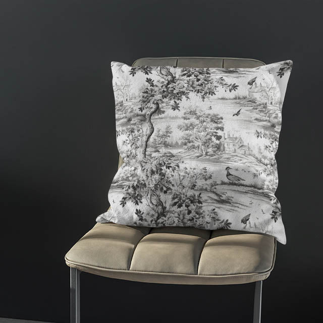 The Avignon Toile Linen Curtain Fabric in black, hanging gracefully in a sunlit room