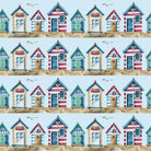 Beach Huts Cotton Curtain Fabric in Blue, featuring charming seaside huts and boats