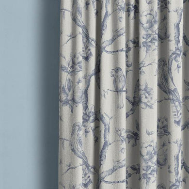 Bilberry Linen Curtain Fabric - Blue draped over a window