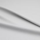 White blackout thermal curtain lining providing complete light blockage and insulation