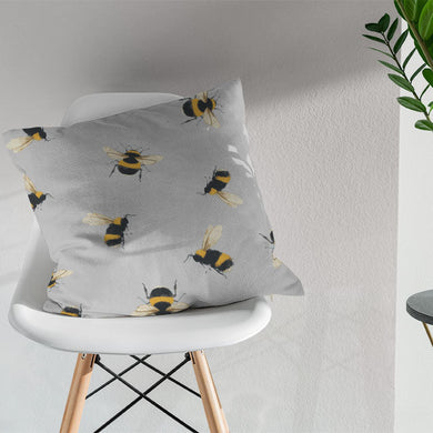 Grey cotton fabric with charming bumble bee pattern, perfect for curtains
