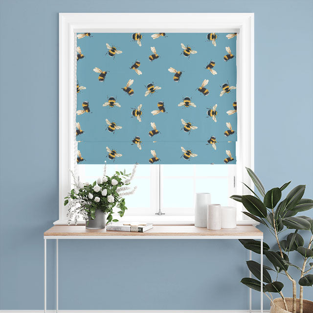 Lagoon-colored fabric with cute bumble bee design