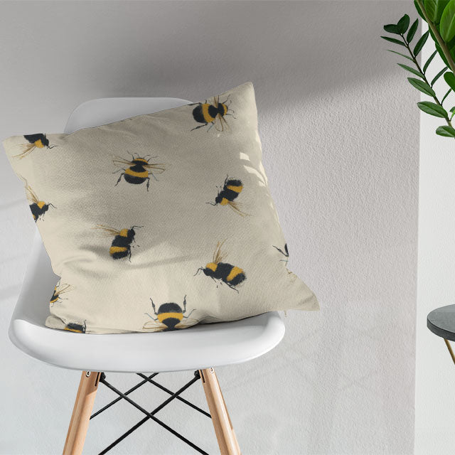 Bumble Bee Cotton Curtain Fabric - Linen being draped over a window in a cozy bedroom