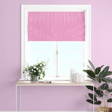 A pair of Candy Stripe Cotton Curtain Panels in Cerise, hanging beautifully in a sunlit room