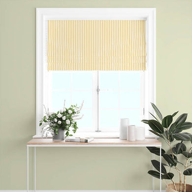 Candy Stripe Cotton Curtain Fabric - Ochre, displayed as a full-length curtain to showcase its bold and vibrant design The ochre and white stripes stand out against the light, adding a touch of warmth and energy to the room This fabric is perfect for creating a cheerful and lively atmosphere, making it an ideal choice for a contemporary and stylish home decor