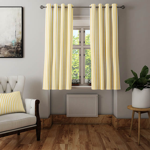 Candy Stripe Cotton Curtain Fabric - Ochre, featuring a close-up of the fabric's rich ochre color and soft cotton texture The subtle variations in the ochre hue add depth and interest to the fabric, making it a versatile and eye-catching choice for curtains, upholstery, and other home decor projects Its durable and easy-care nature makes it a practical and stylish option for any interior design scheme