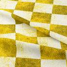 Elegant Ochre Checkers Cotton Curtain Fabric draping gracefully on a curtain rod in a well-lit room