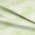 Lime Cloud Cotton Curtain Fabric draping elegantly in a sunlit room