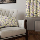 Country Garden linen curtain fabric in Butter – styled cushion and curtain in a cream armchair room setting