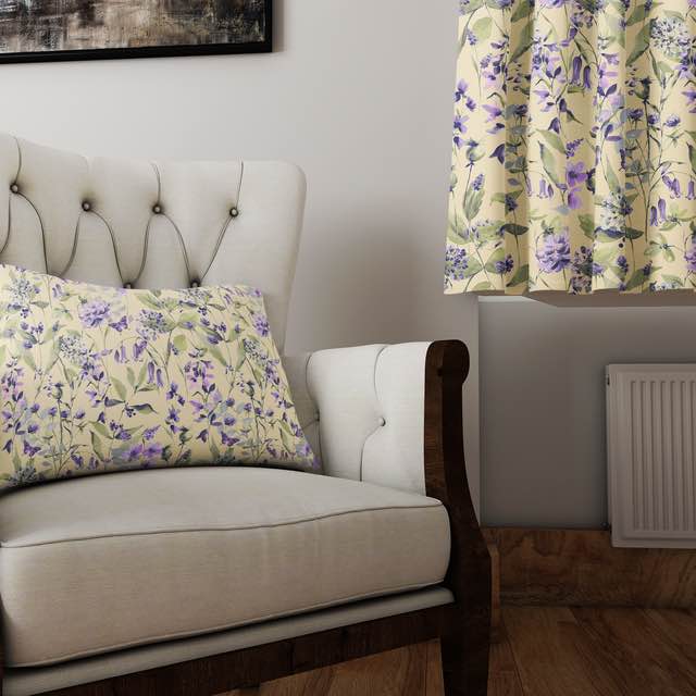 Country Garden linen curtain fabric in Butter – styled cushion and curtain in a cream armchair room setting