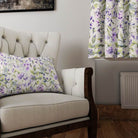 Linen curtain and cushion in Country Garden Lilac fabric styled in a soft neutral living space