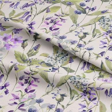Folded Country Garden Lilac linen fabric showing purple floral and leafy print in detail
