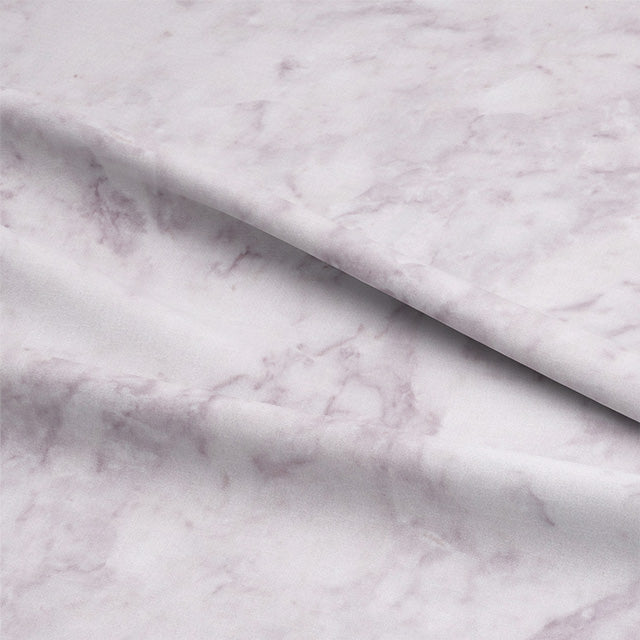 Close-up of Dapple Cotton Curtain Fabric in Rich Amethyst Shade