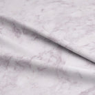Close-up of Dapple Cotton Curtain Fabric in Rich Amethyst Shade