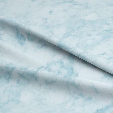Close-up of Dapple Cotton Curtain Fabric in stunning Azure color