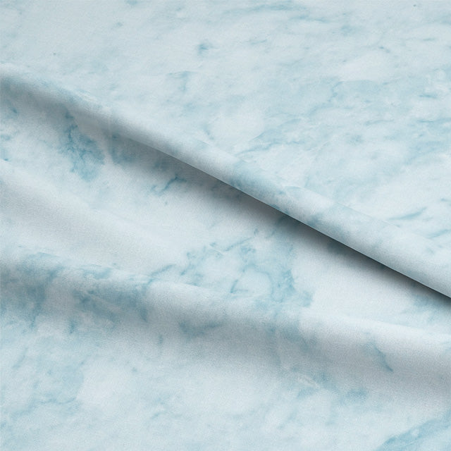Close-up of Dapple Cotton Curtain Fabric in stunning Azure color