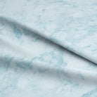 Close-up of Dapple Cotton Curtain Fabric in stunning Azure color