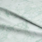 Close-up of the Dapple Cotton Curtain Fabric - Mediterranean, showcasing its intricate woven texture