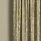 Luxe gold curtain fabric featuring a delicate plume design, ideal for creating a sophisticated and opulent atmosphere