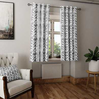Delilah Cotton Curtain Fabric in Grey swatched against a neutral background, showcasing its versatility and timeless appeal
