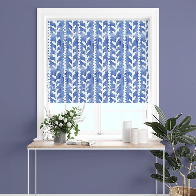 Delilah Cotton Curtain Fabric - Royal Blue, hanging elegantly in a living room, adding a touch of sophistication