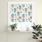 Egg Jar Cotton Fabric - Blue draped over a chair, showcasing its soft texture and beautiful hue