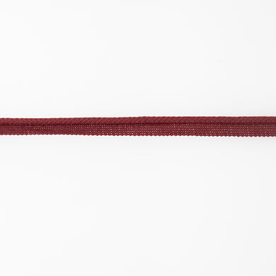 Red upholstery flanged piping cord