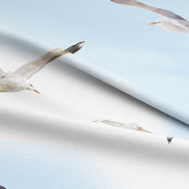 Beautiful blue Flying Gulls Cotton Curtain Fabric, ideal for a beach house