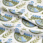 Close-up of Folk Hens Cotton Curtain Fabric in Olive Blue, showcasing the intricate details of the hand-drawn hens and foliage pattern
