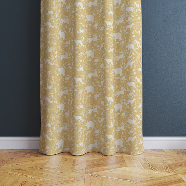 Beautiful Ochre Forest Friends Linen Curtain Fabric draping gracefully in a rustic living room