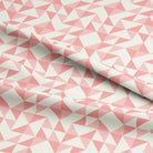 Close-up of the detailed geometric pattern of the Geometry Cotton Curtain Fabric - Carnation