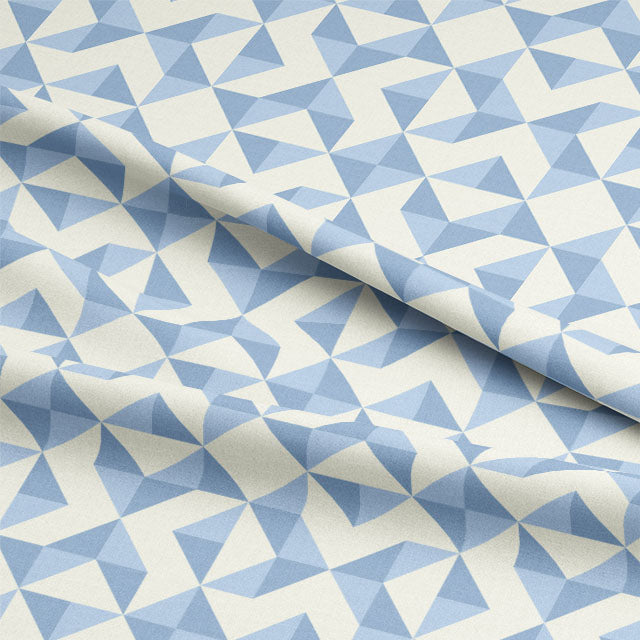 Close up of the Geometry Cotton Curtain Fabric - Sky, showcasing the intricate details of the geometric pattern and the soft texture of the fabric