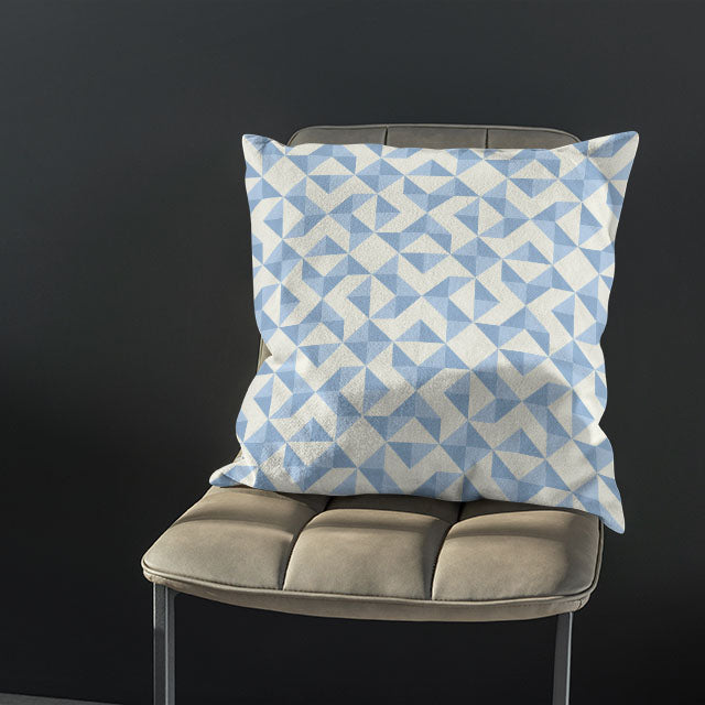 A stylish room setting with the Geometry Cotton Curtain Fabric - Sky draping elegantly as window curtains, adding a touch of sophistication to the space