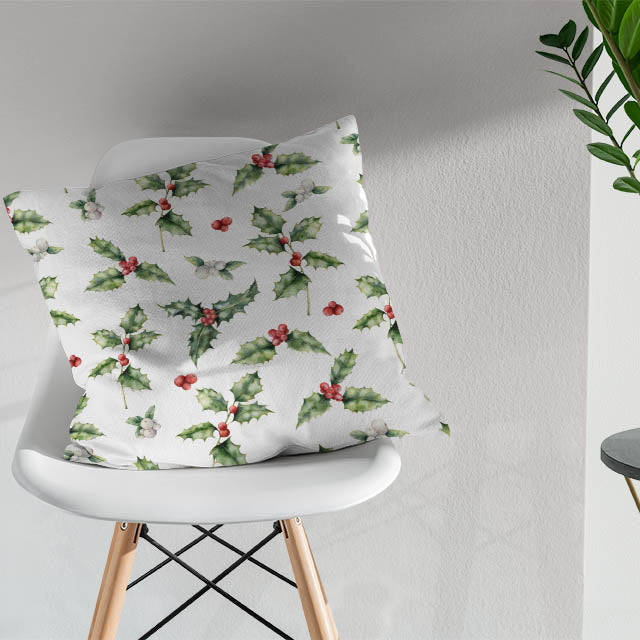 White cotton curtain fabric adorned with traditional Christmas botanical motifs