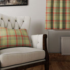 A pair of Maree Plaid Linen Curtain Panels in Moss, elegantly draping and adding a refreshing pop of color to a sunlit living room