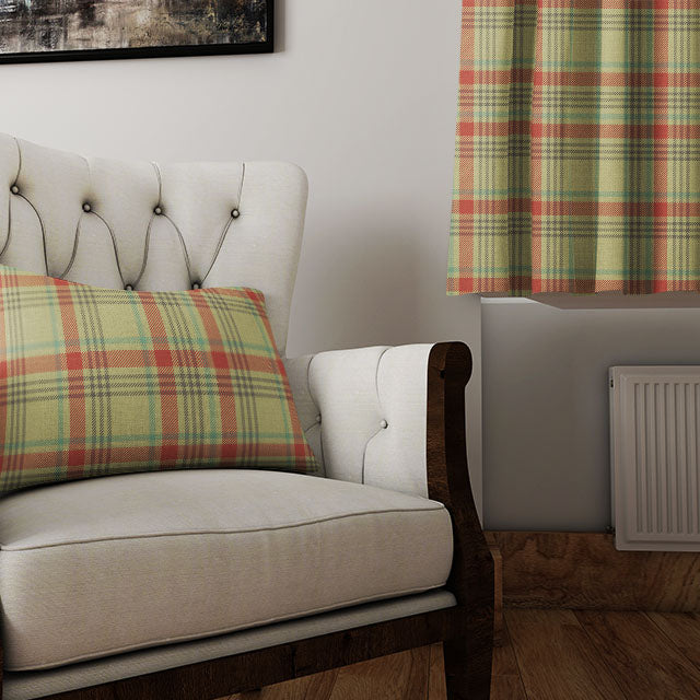 A pair of Maree Plaid Linen Curtain Panels in Moss, elegantly draping and adding a refreshing pop of color to a sunlit living room
