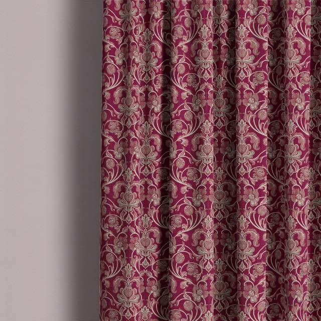 Beautifully designed Claret cotton fabric hanging as elegant curtains, creating a warm and inviting atmosphere in a living room