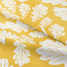 Close-up of soft and durable Oak Leaf Cotton Curtain Fabric in sand