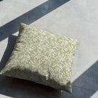 Oxford Leaf Green leaf pattern cushion styled on a neutral tiled floor