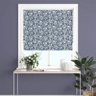 Roman blind made from Oxford Leaf Indigo fabric in white-framed window