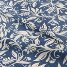 Oxford Leaf Indigo fabric draped to show blue base with ivory leaf print