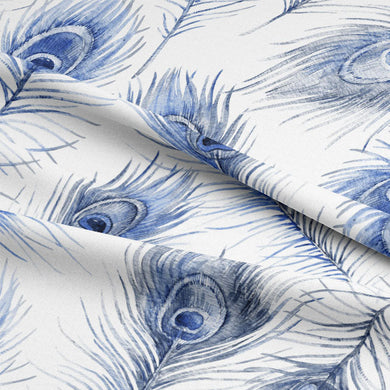 Beautiful ink-colored peacock feather patterned fabric draping as a curtain