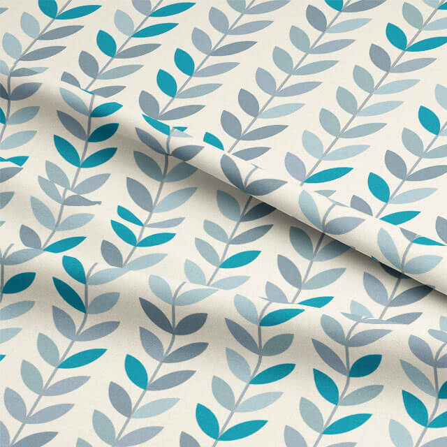 Draped view of Scandi Stem Azure fabric showing natural flow and print scale