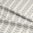 Folded view of grey Scandi stem pattern printed on linen blend basecloth